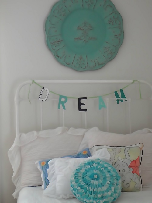 This is close up of bed and wonderful medallion I recently found at Hobby Lobby.. Am thinking about painting the bed black for a little more contrast.