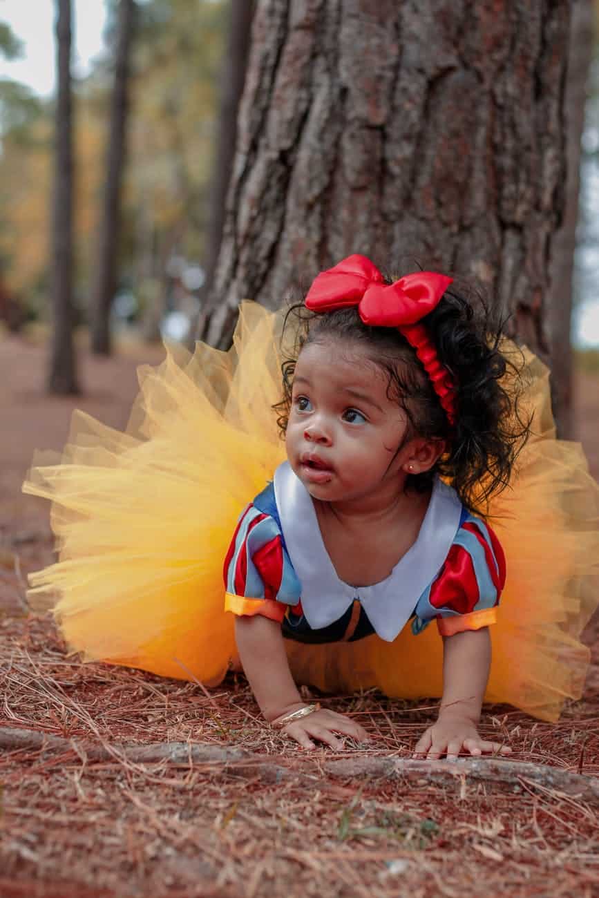 photo of baby girl in tutu dress crawling near tree/guilt-free joy