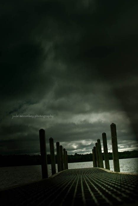 anxietyfearinspirational | goodthoughtsgoodlives a dock on the water on a dark and storm day. Very gloomy