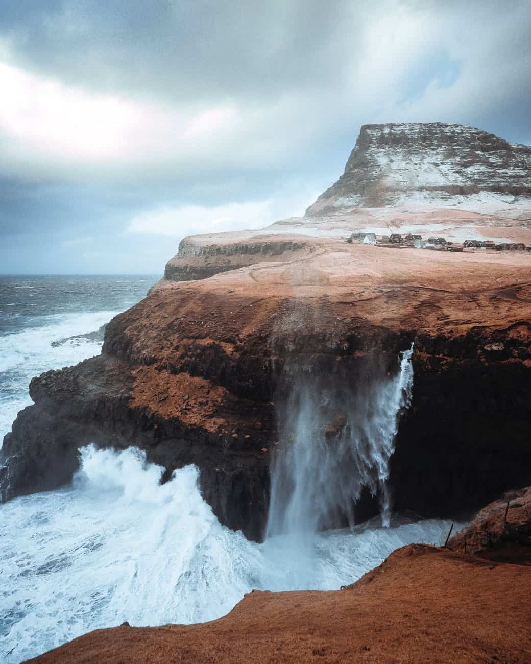 stormy sea with rocky cliffs in daylight/trusting God intentionally
