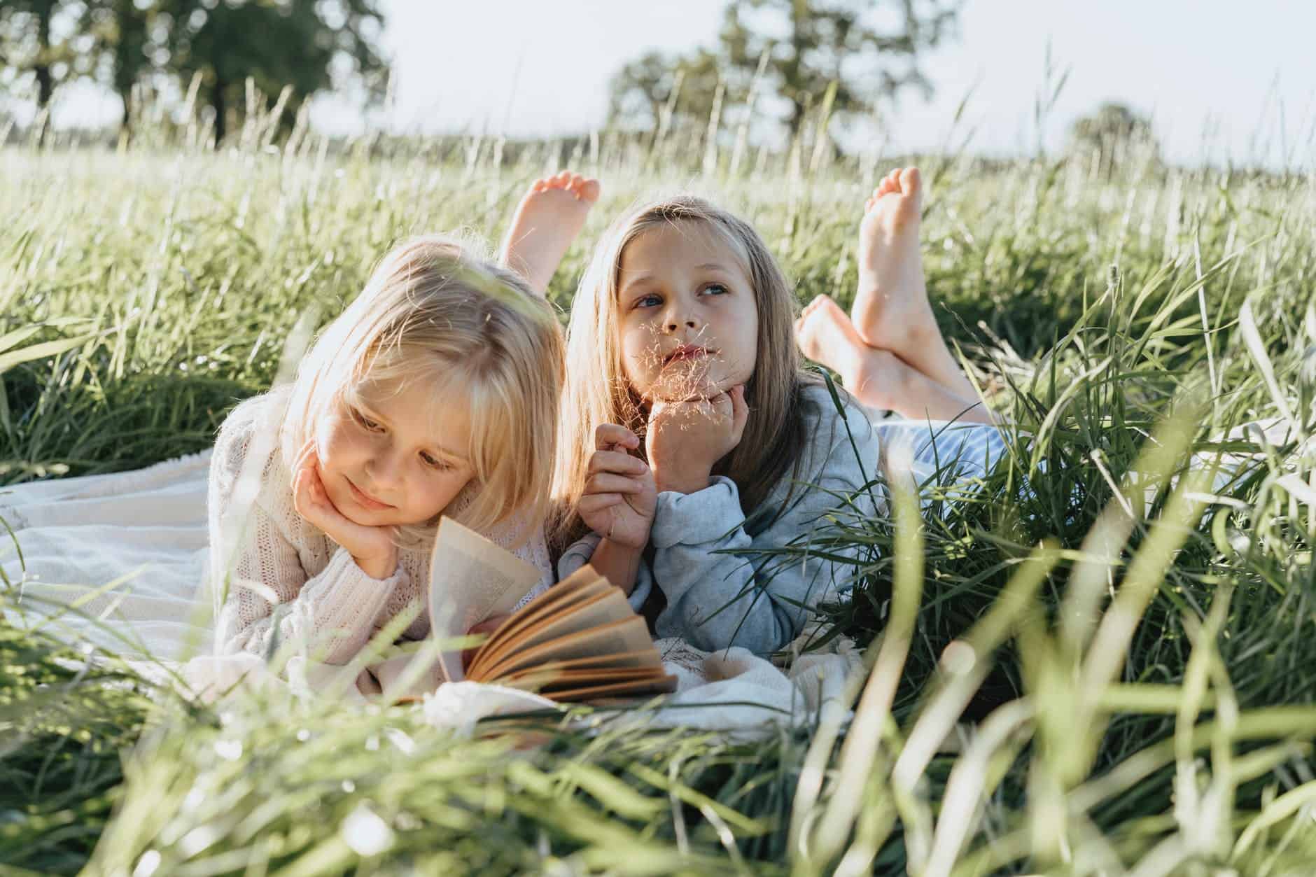 pexels-photo-4982457 | goodthoughtsgoodlives little girls lying on green grass field/think more