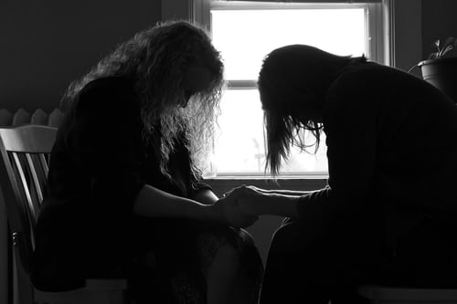 two women praying/anxiety