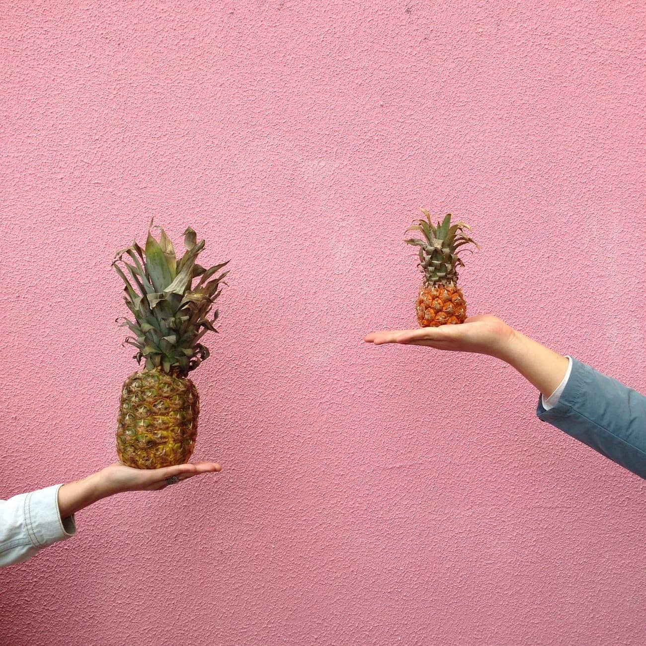 two different sized pineapples/big and small goals