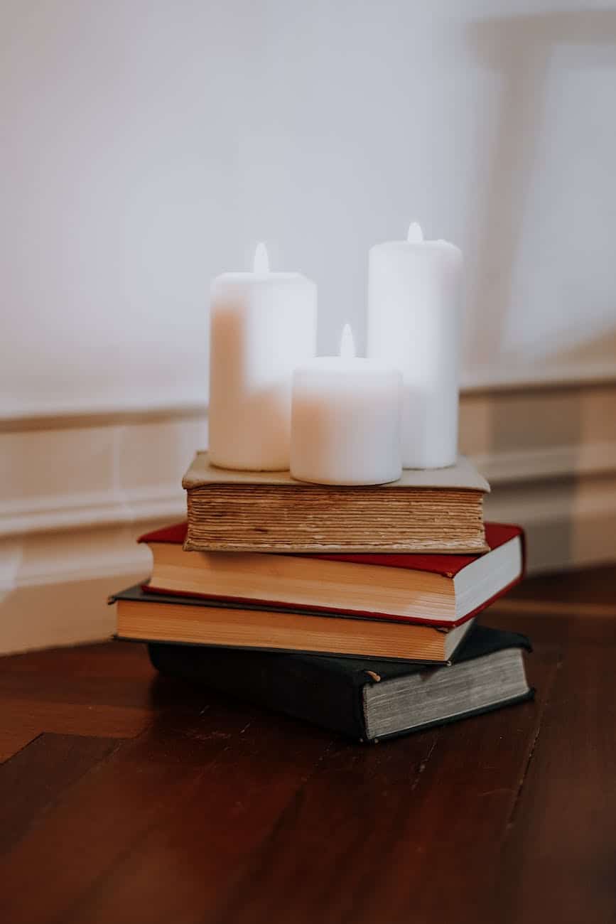 pexels-photo-3693115 | goodthoughtsgoodlives photo of candles on top of books/personal spaces