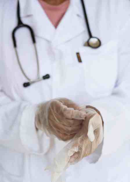 crop doctor with stethoscope preparing for surgery in hospital