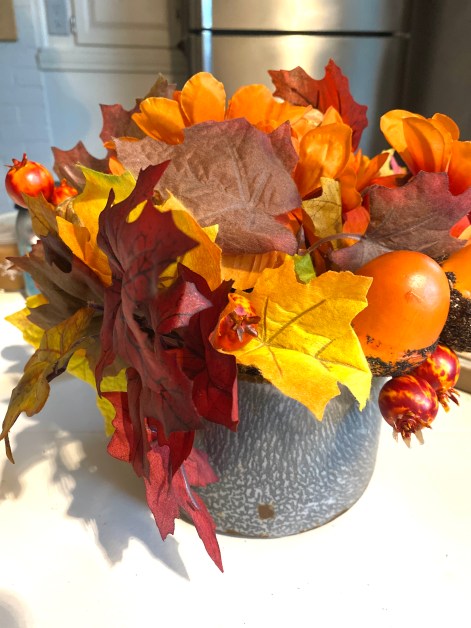 kitchen centerpiece from old tin pail/junking

