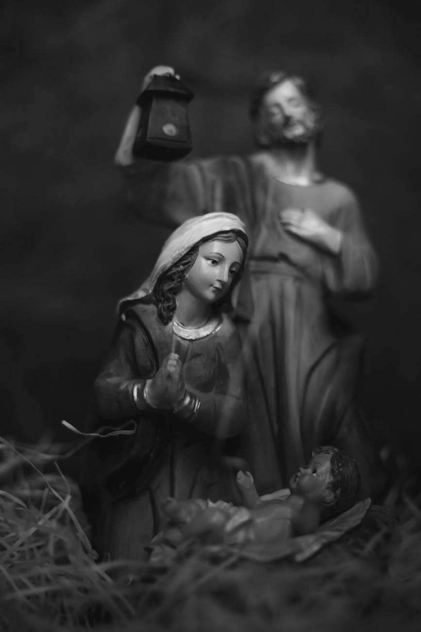 grayscale photo of figurines of mother mary and baby jesus christ