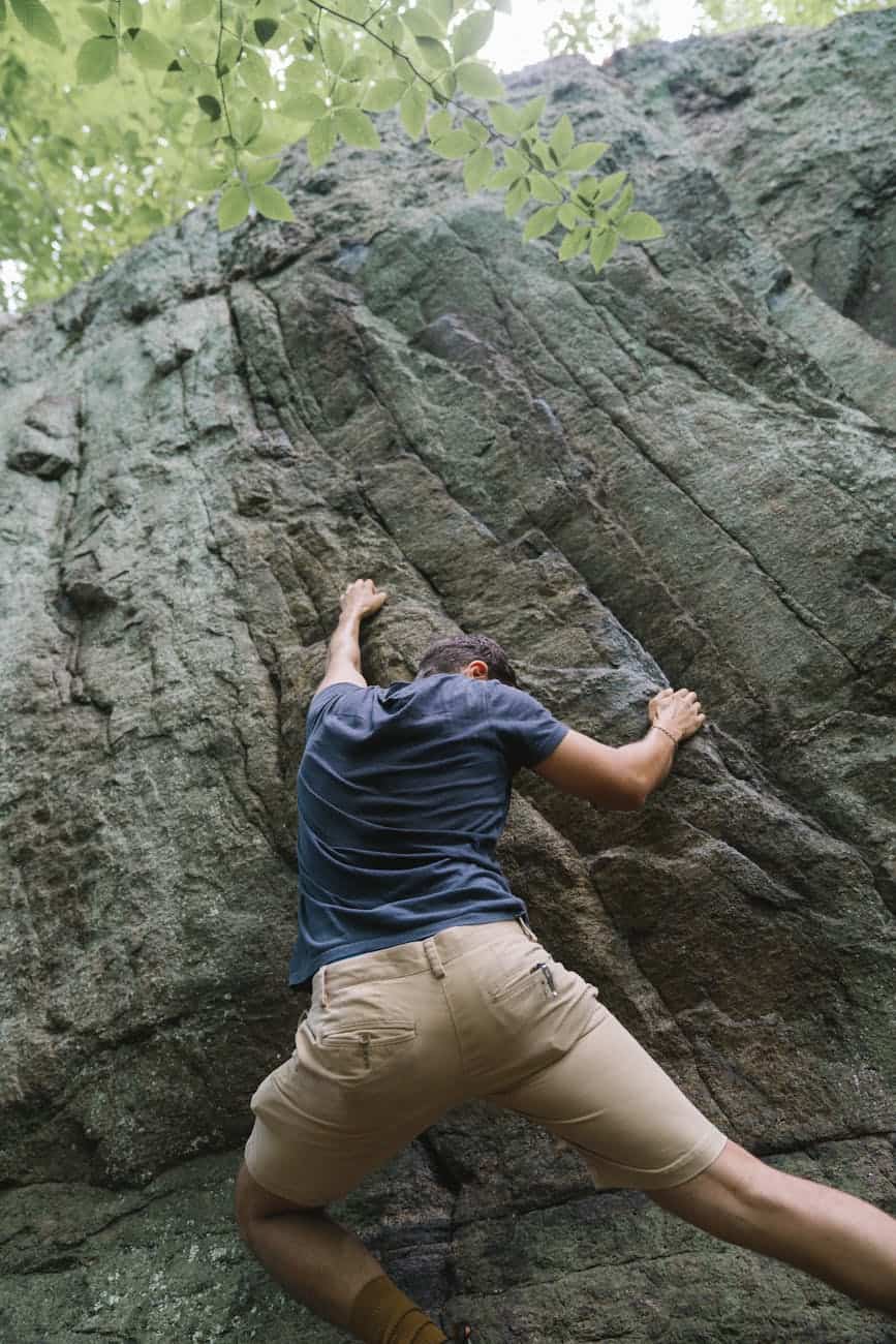 find joy (a man climbing a rock)
