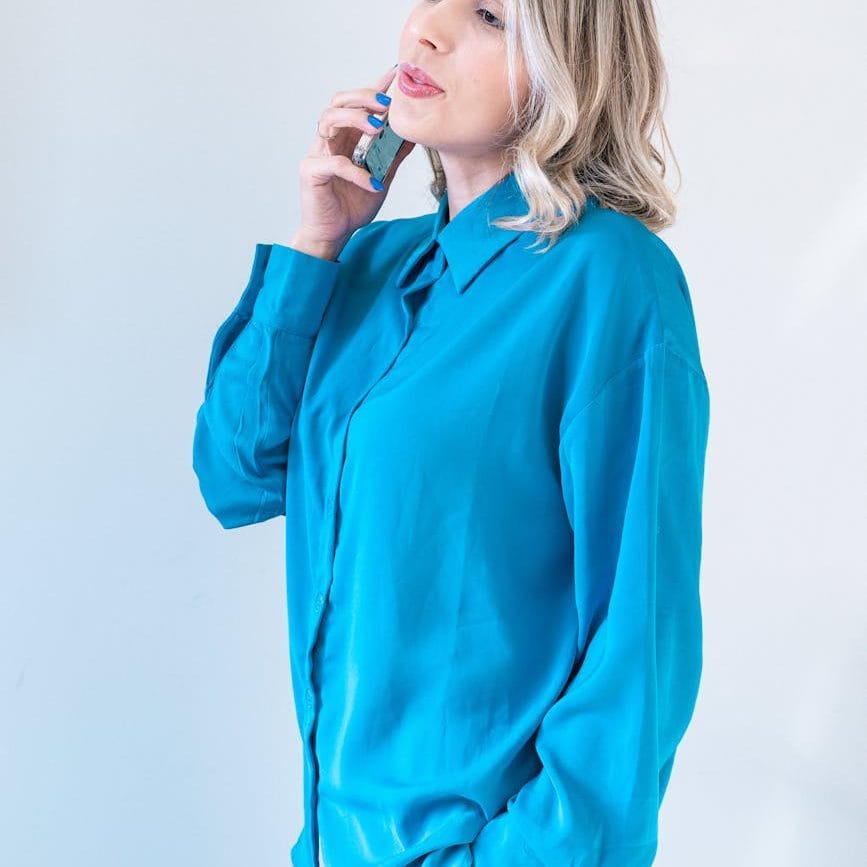 blonde woman talking on phone/Stop waiting. Live your life.