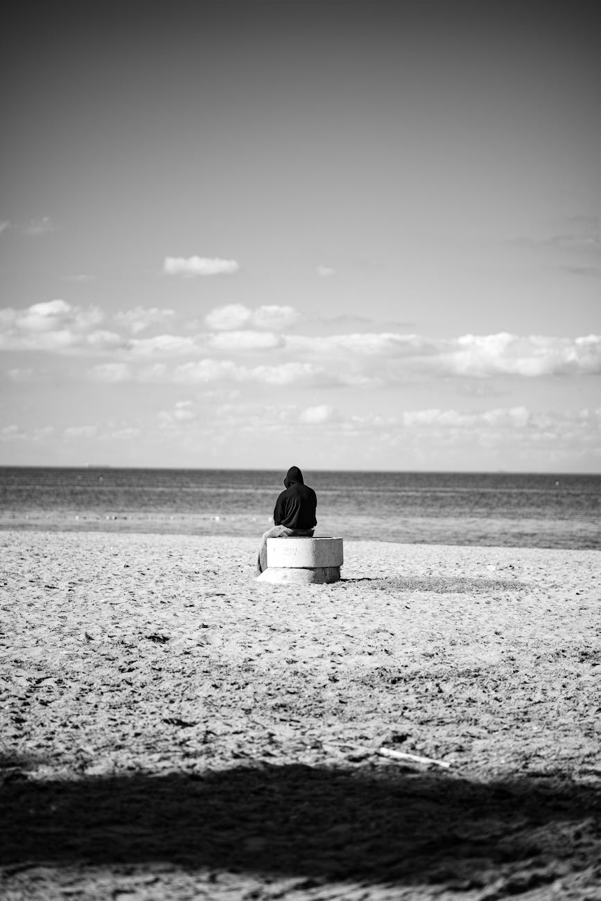 solitary figure on  beach /pray 